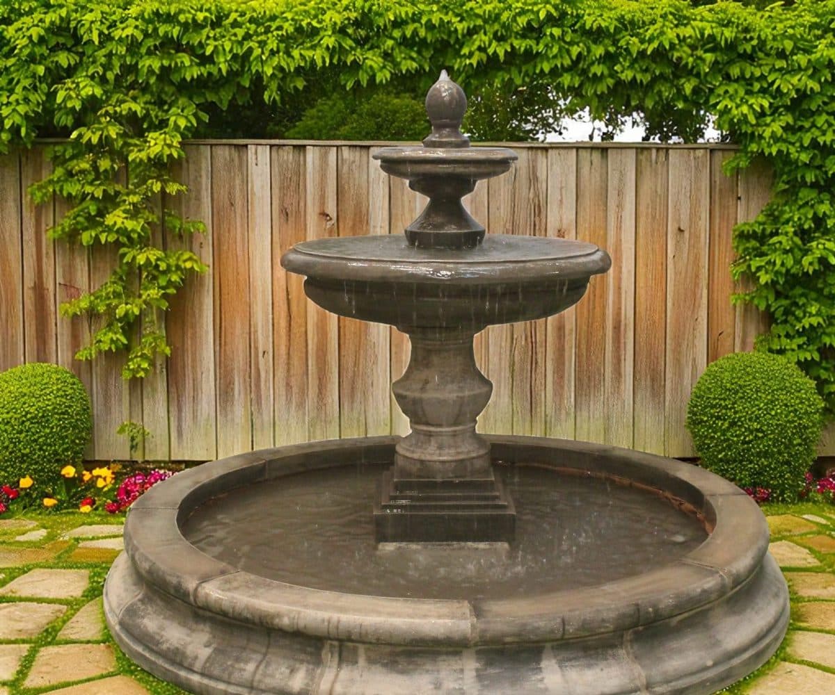 A traditional two-tiered fountain with a round pool surround