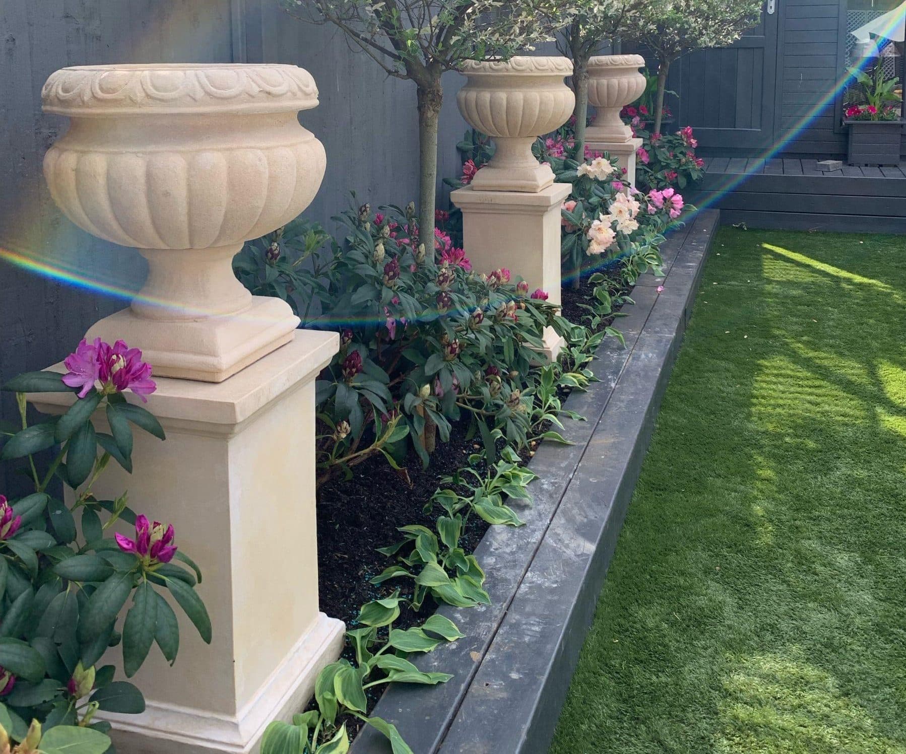 Pair of Danbury Urns on Classic Plinths