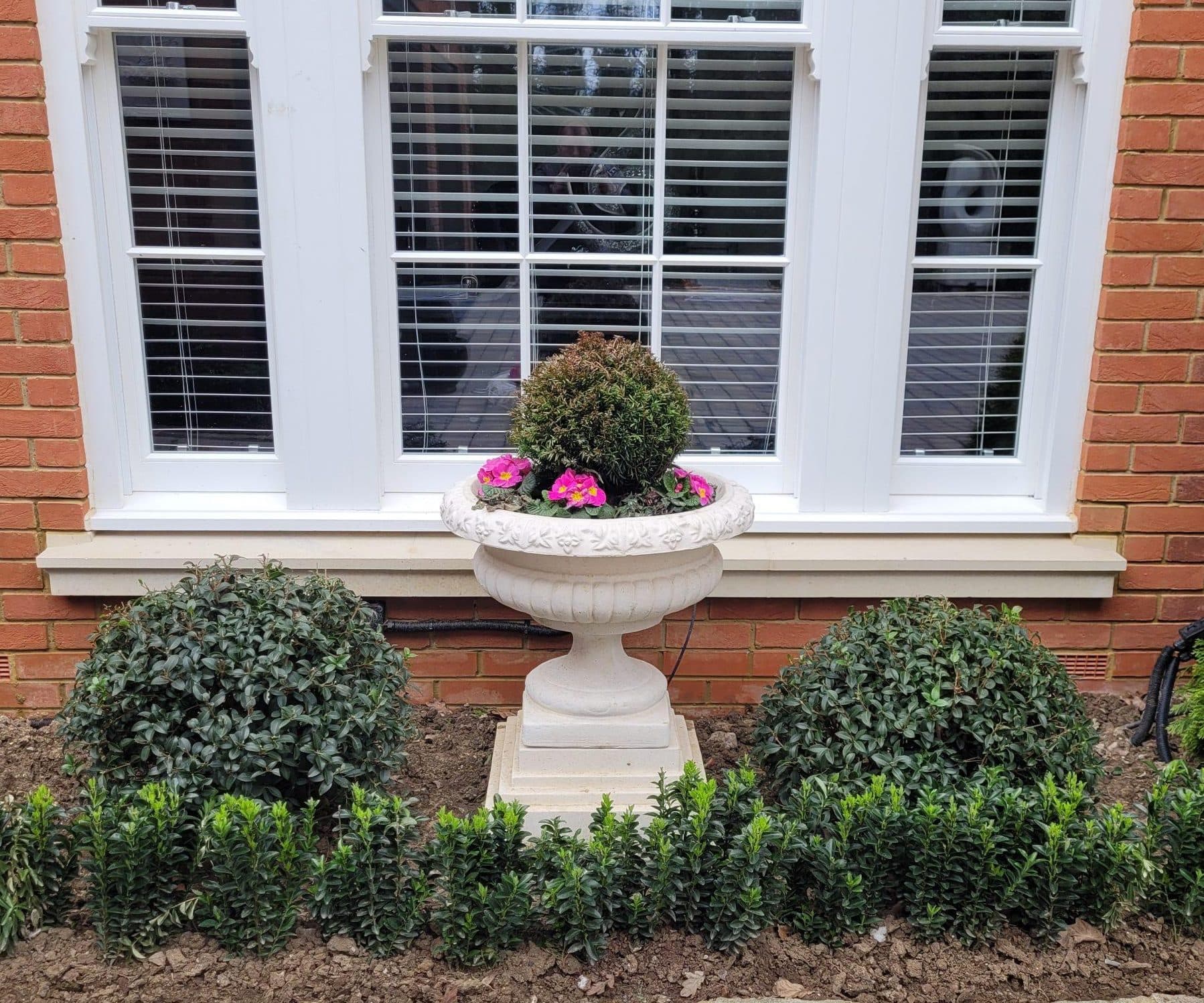 Pair of Victorian Urns on Regis Plinths