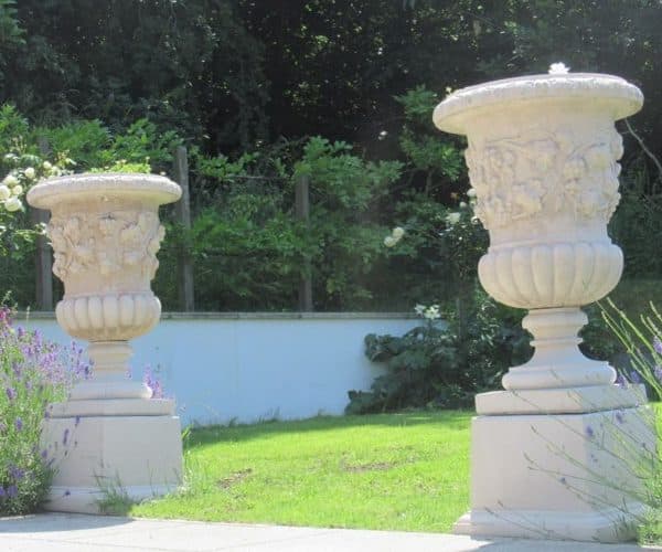 Pair of Vine Urns on Plateau Plinths