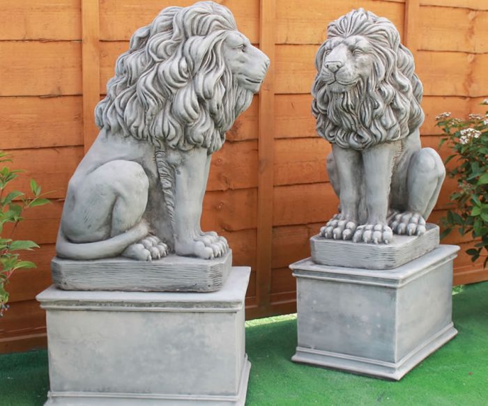 sitting lions plinths